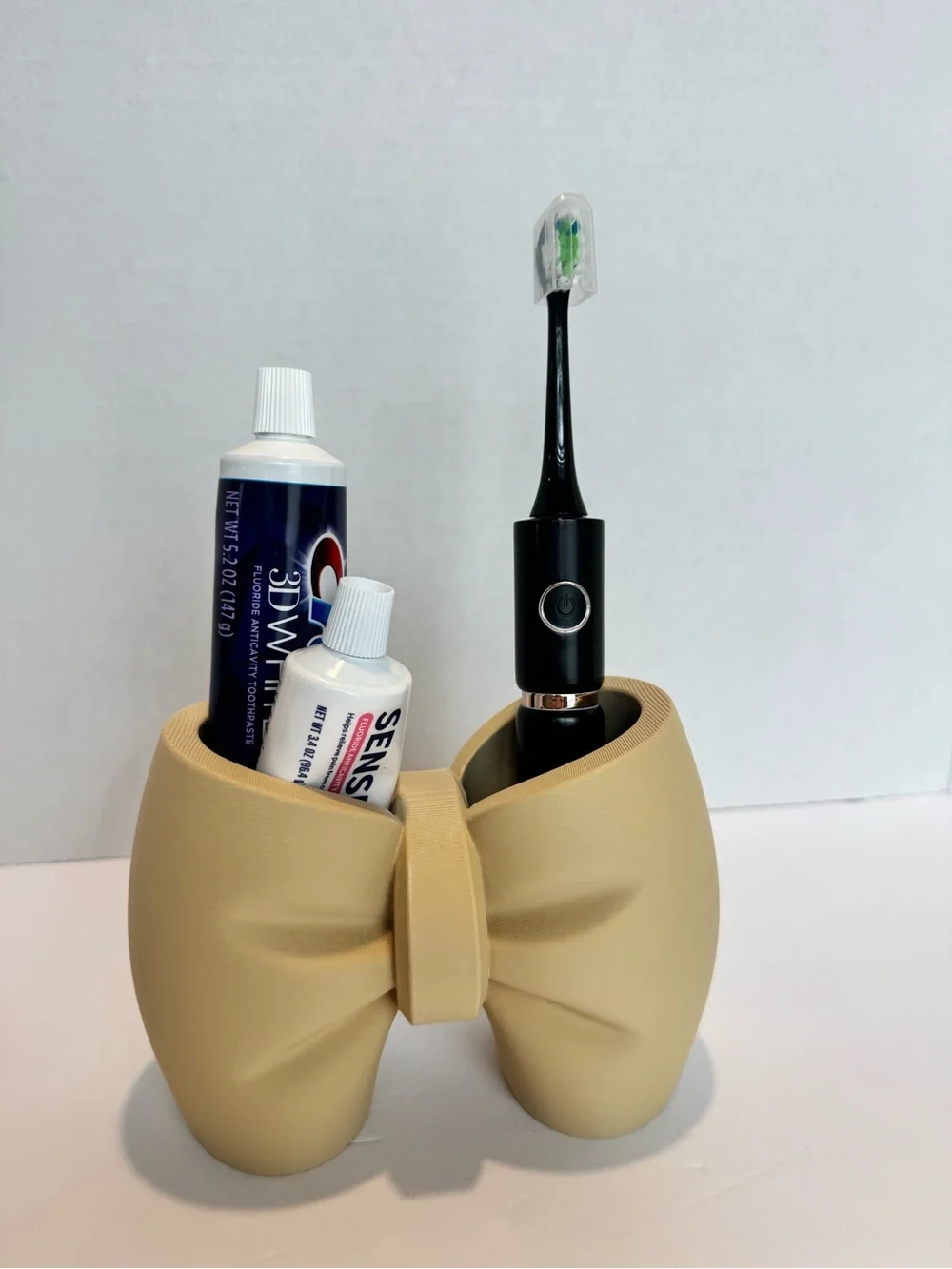3d printed Bow-Shaped Toothbrush & Toothpaste Holder in Beige